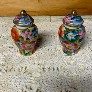 Oriental looking set of trinket covered vase